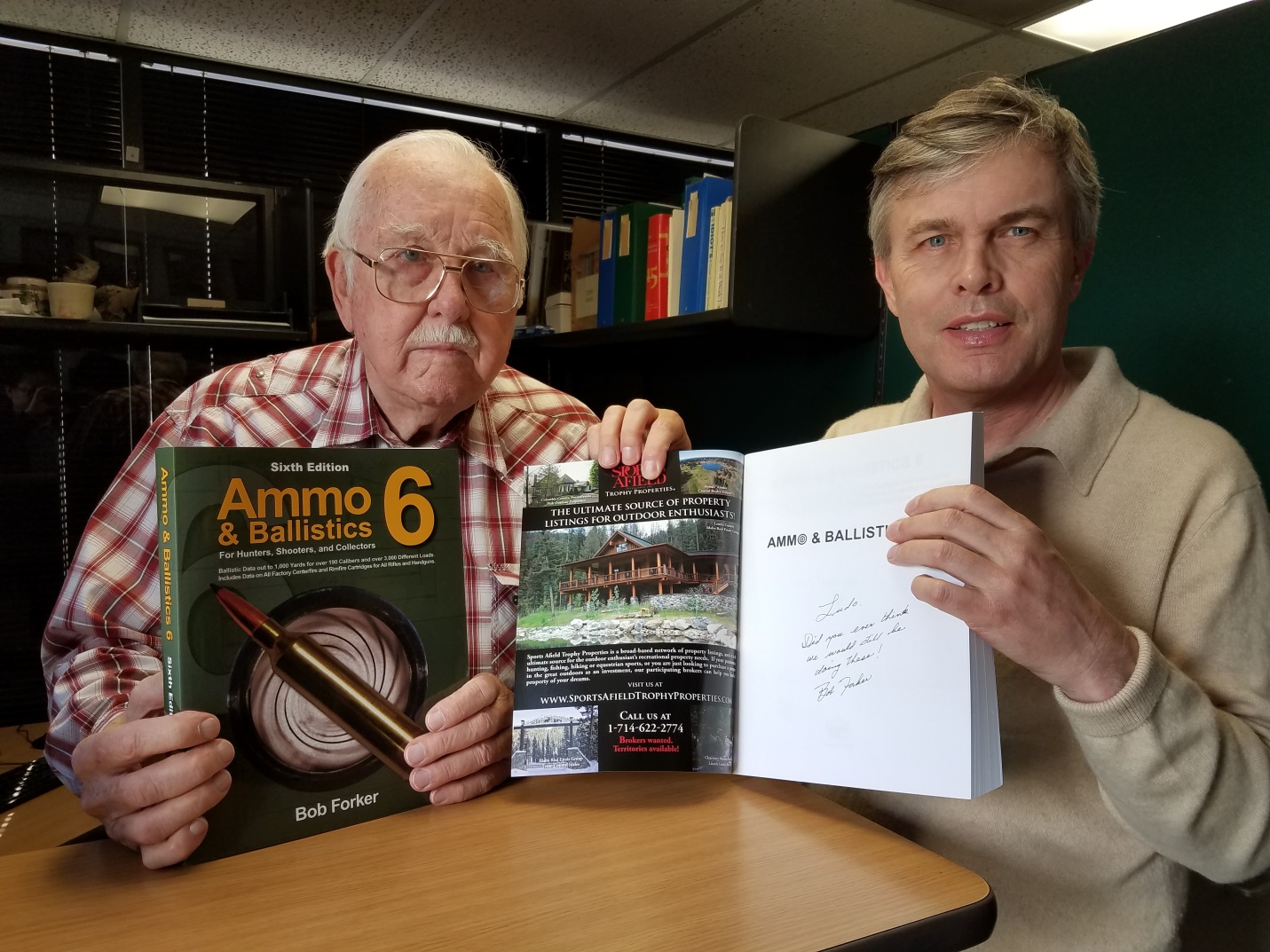 Robert Forker signing a copy of Ammo and Ballistics 6